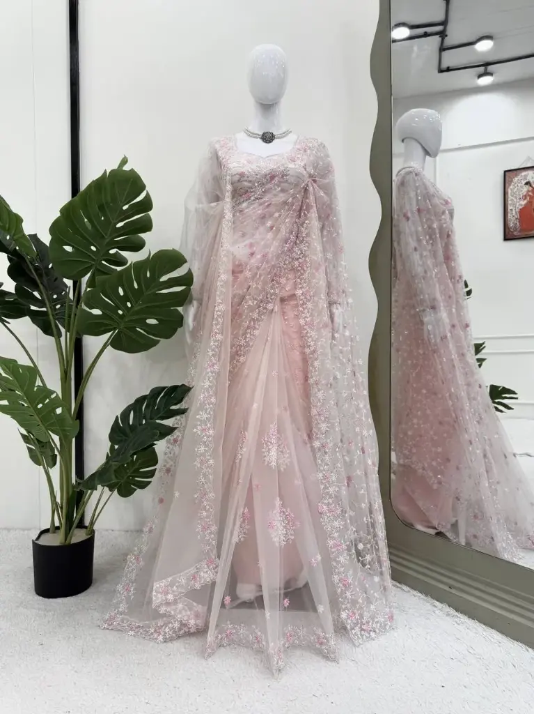 stunning saree in an eye-catching shade, crafted with finesse and rich detailing. A perfect blend of grace and glam